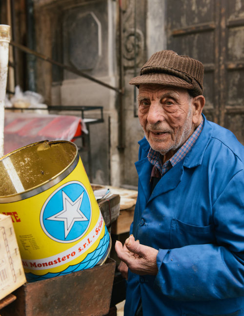 Sardine seller in Ballaro market, Palermo.