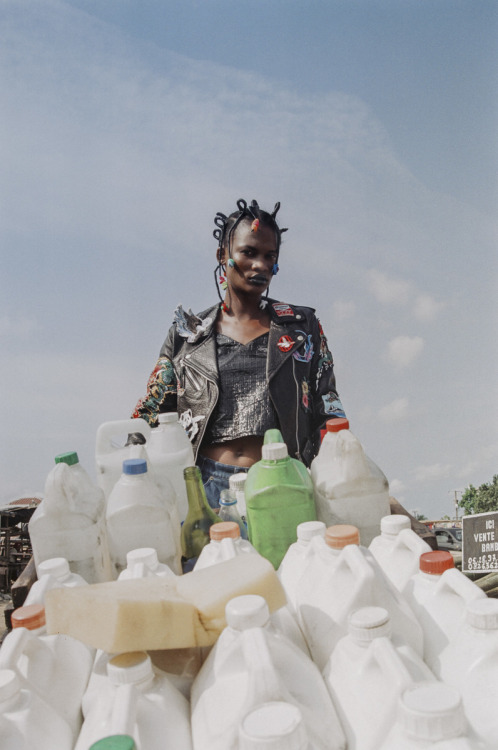 Dressed up in distressed, patched and unconventional clothing, shot on location in Abidjan, stylist 