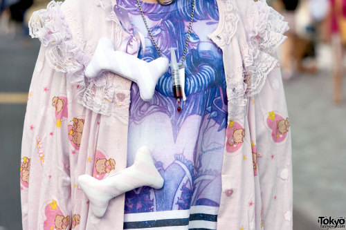 16-year-old Pinkyuamomota on the street in Harajuku wearing a Milklim robe (with plush bones) over a