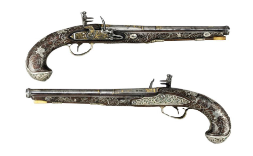 A pair of silver and gold inlaid flintlock pistols originating from Turkey, late 18th or early 19th 