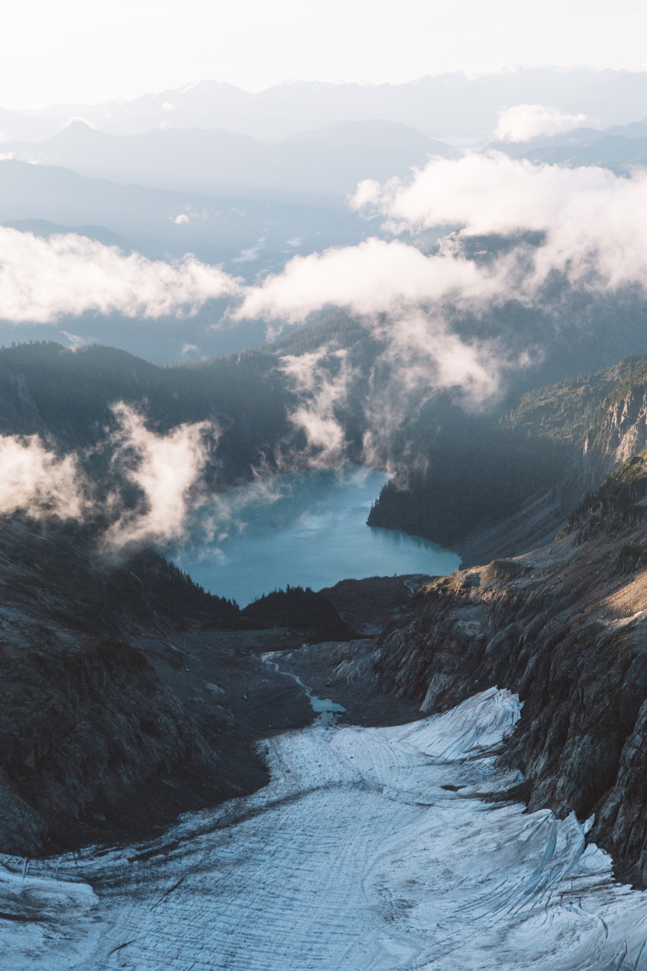 forrestmankins:  Flying over the mountains, trees, and clouds in the central Cascades.Prints