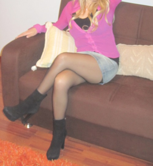 Woman in sheer black pantyhose and denim skirt crossing legs. Submission by Fashionhuntering. Thanks