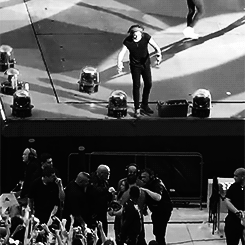 dudski:  Harry gets a fan’s attention as she’s being helped by security. 