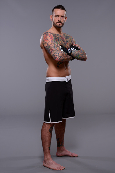 thepunknation:UFC Photoshoot Part Two‘DALLAS, TX - MARCH 13:  Phil ‘CM Punk’ Brooks poses for a photo during a UFC photo session at the Hilton Anatole Hotel on March 13, 2015 in Dallas, Texas. (Photo by Mike Roach/Zuffa LLC/Zuffa LLC via Getty