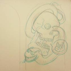 Work in progress with a skull and snake.