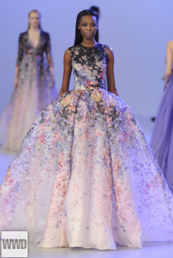 womensweardaily:  Elie Saab Couture Spring 2014 Photo by Giovanni Giannoni The designer showered a cascade of fabric petals on evening gowns inspired by Victorian painter Sir Lawrence Alma-Tadema’s oeuvre.  For More 