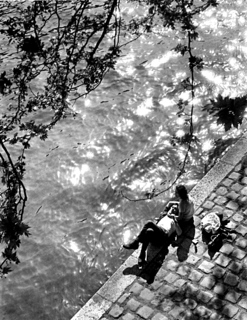  Lovers on bank of Seine near Notre Dame Cathedral ,  Paris, 1963 by  Alfred Eisenstaedt 