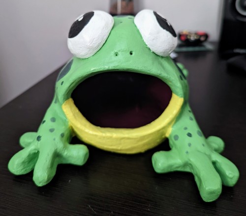 Repainted an old frog sculpture :) It can fit my fist in its mouth easily. Mostly use it to dry pain
