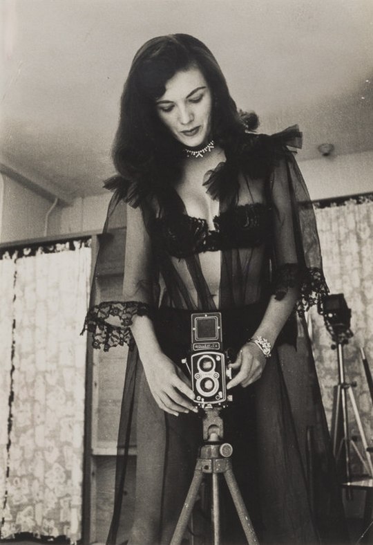steroge:  Bunny  Yeager in Black Lace with Her Rolleiflex Camera, 1955  Photo by