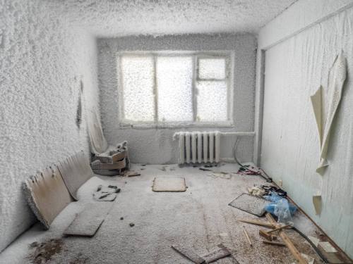 redlipstickresurrected:Maria Passer/Anadolu Agency/ - Vorkuta, Komi Republic, Russia   -   An inside view from snow and ice covered abandoned building in Severny region in Komi Republic. The extremely cold climate in Vorkuta, where temperatures can be