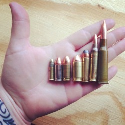 lipsticknperfume:  Just fucking around today. Decided to lay out all the bullets we have on my hand for scale for shits and giggles. From left to right: .22LR, 9mm (9x19) Jacketed Hollow Point, 9mm (9x19) Full Metal Jacket, .45 ACP Jacketed Hollow Point,
