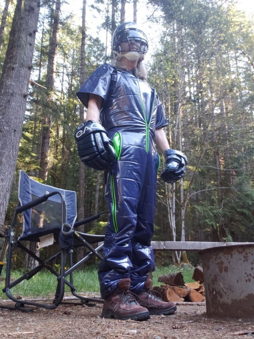 hockeydogwoof:Hanging out at the fire pit in blue puffy PVC overalls, t-shirt, and other happy gear.