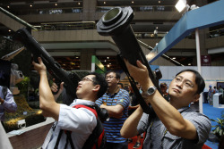 LOCK AND LOAD: Visitors to the Taiwan Aerospace &amp; Defense Technology Expo aimed shoulder-fired Kestrel HEAT Rockets in Taipei, Taiwan, Friday. (Wally Santana/Associated Press)