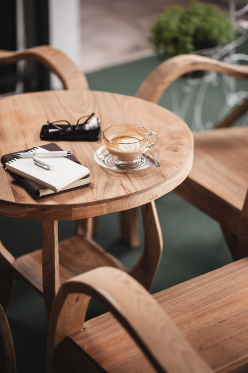 Coffee cup on rustic wood table by silaaa