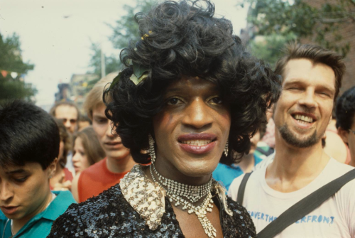 milkandheavysugar:Marsha P. Johnson within the crowd at a New York Gay Pride (1982)