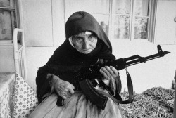luciferlaughs:  A photo of a 106-year-old woman guarding her house with an automatic weapon in Armenia as armed conflicts took place in her area. 