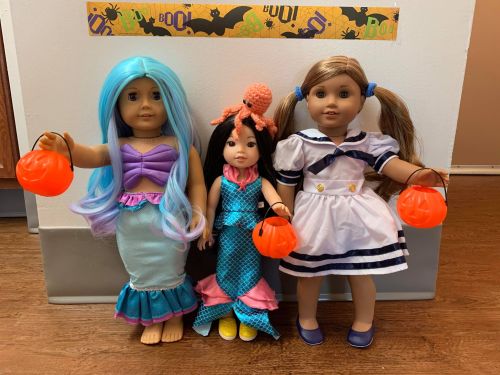 A Very Merry American Girl Halloween. Some of the dolls are wearing the same costumes from last year
