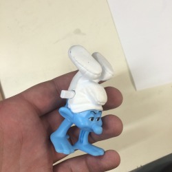 grimelords:  A woman who doesn’t work here anymore brought this weird smurf toy into work a couple of months ago and set it on top of the computer because apparently her kids wouldn’t stop fighting over it and I hate it every day. It sits up there