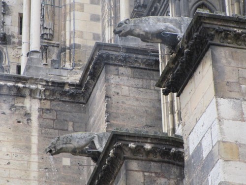 A few gargoyles on the Basilica of Saint-Remi in Reims.  These guys were doing their job, spitting o