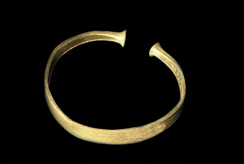 A torc (neck ring) made of gold. Dated to the Iron Age, and found in Potterne, Wiltshire, England.Co