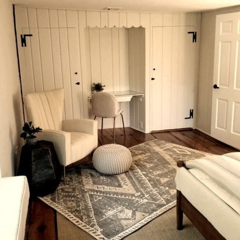 Farmhouse Bedroom - BedroomMedium Tone Wood Floor, Brown Floor, Exposed Beam, And Shiplap Wall Bedroom