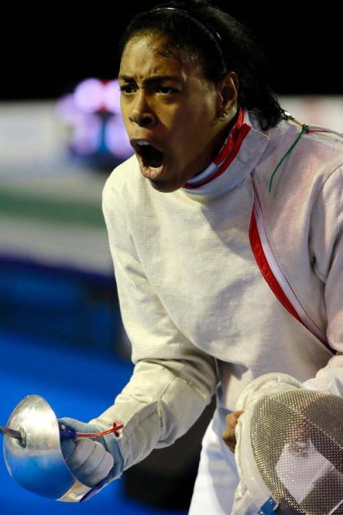 modernfencing:[ID: a sabre fencer shouting with her mask off.]Jenifer Carriera at the 2015 Pan Ams! 