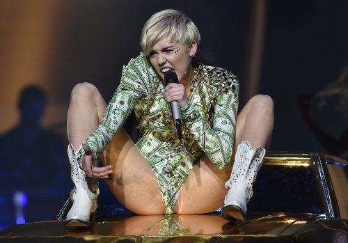 pornwhoresandcelebsluts:  Miley Cyrus does more slutty spread leg crotch shots live in concert on the Bangerz tour