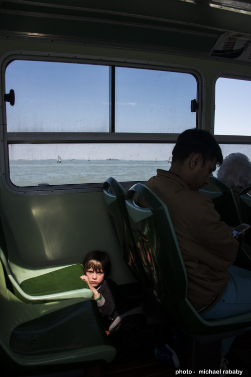 boy in vaporetto, venice.