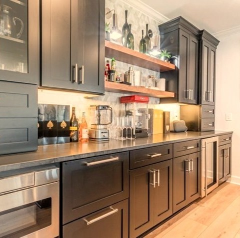 Basement Walk OutLarge Transitional Walk-out Light Wood Floor And Beige Floor Basement Photo With A Bar