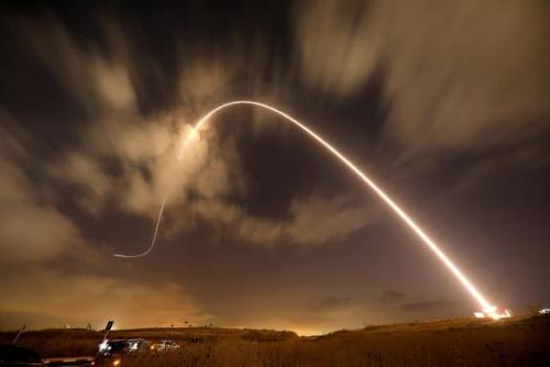 Iron Dome anti-missile system fires an interceptor missile as rockets are launched from Gaza towards