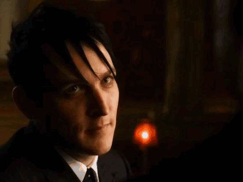 oswald leaning in saying 'friends don't owe friends, silly'