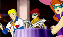 scoobydoomistakes:  Though Velma loses any sign of Fred next to the newspaper, just a frame later in the closeup……she does gain smugness.Immense smugness.