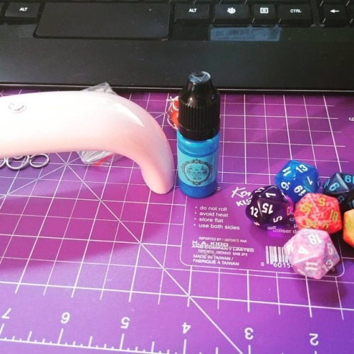 Picked up some new D20 dice for more necklaces! I also got my UV lamp and some blue UV resin to expe
