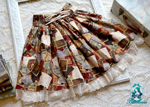  To the Library SkirtThis high-waist skirt is made with a rich book fabric with gold and ivory lac