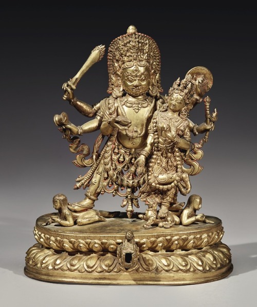 hinducosmos:Bhairava and Shakti18th Century, Nepal. A Gilt Copper Figure. Height 10 3/8in. 26.3 cm. 