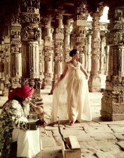 alwaysbevintage:  The Pillars of Quwwat-Ul-Islam Mosque at dusk. Barbara Mullen wearing a gold lame ball gown by Christian Dior photographed by Norman Parkinson, India, British Vogue, 1956 