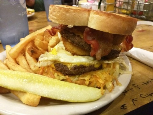 superchocbear:  The Farmer Jon:  Double cheeseburger with bacon, hash browns, a fried egg and an onion ring.   My boyfriend is such a fat fuck, and I couldn’t love him more for it! Look at this burger he got!