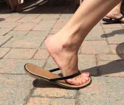 mesmerizingfeet:  Yummy foot in a brand new leather flip-flop.