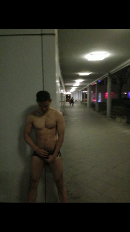 athleticpisspig:Me pissing on myself just wearing a rubber shorts in a pedestrian walk with people w