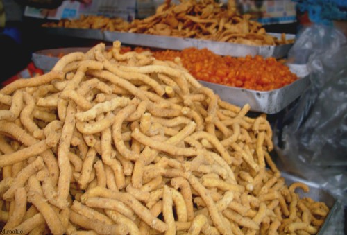 Typical halwai stand, sweet and savoury snakes. Punjab, India.