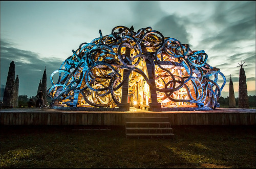 itscolossal:  A Brain-Like Building Turned into a Twisting Video Mapping Light Show 