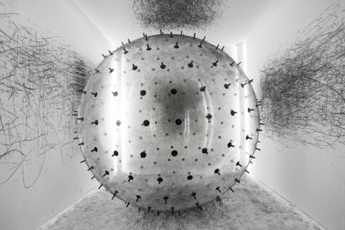 pulmonaire:  ADA by Karina Smigla-Bobinski. This balloon filled up with helium, floats freely in the room with it’s is charcoaled spikes that leave marks on the walls, ceilings and floors.