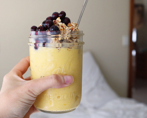 Mango- Pineapple nice cream topped with sticky granola and blueberries. This seriously hit the spot 