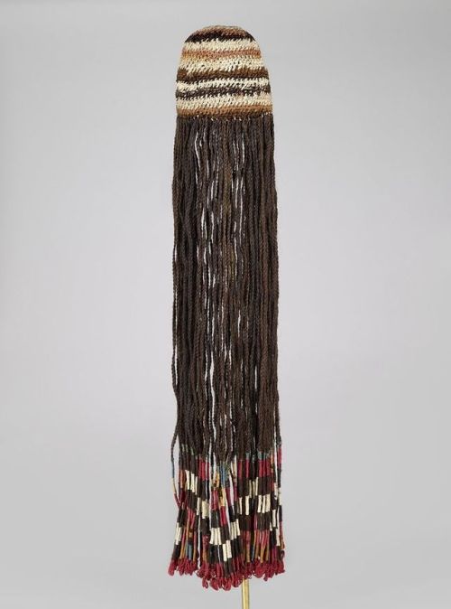 Wig/headdress from the Wari people of modern-day Peru, 600-1000 CE. The woven cotton cap has braids 