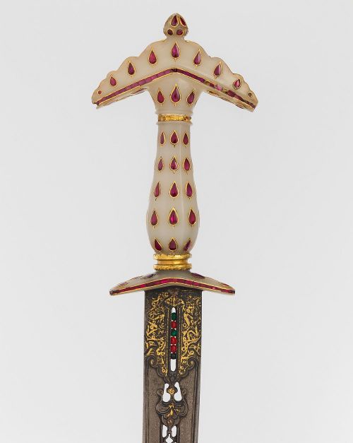 art-of-swords:  Dagger with SheathDated: late 17th centuryCulture: Hilt, Indian, Mughal; blade, Turkish or IndianMedium: Steel, nephrite, gold, rubies, emeralds, silver-gilt, leatherMeasurements: overall length 17 inches (43.18 cm)Source: Copyright ©