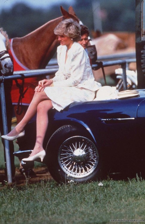 historicaltimes:1987 Princess Diana sitting on the fender of Charles’s vintage Aston Martin