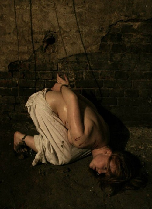 nakedsweatandchains: Her only possession is some rags she found in her cell. She struggle to keep wa