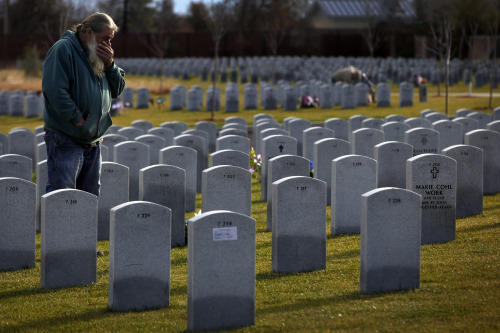 Mark Tyree Sr. visits his son's grave. 