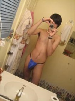 mostlymensunderwear:Skinny guy with an impressively sized g-string pouch 