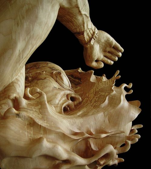 The life-sized &lsquo;Swimmer&rsquo; (basswood, mounted on black walnut) by Steff Rocknak ma